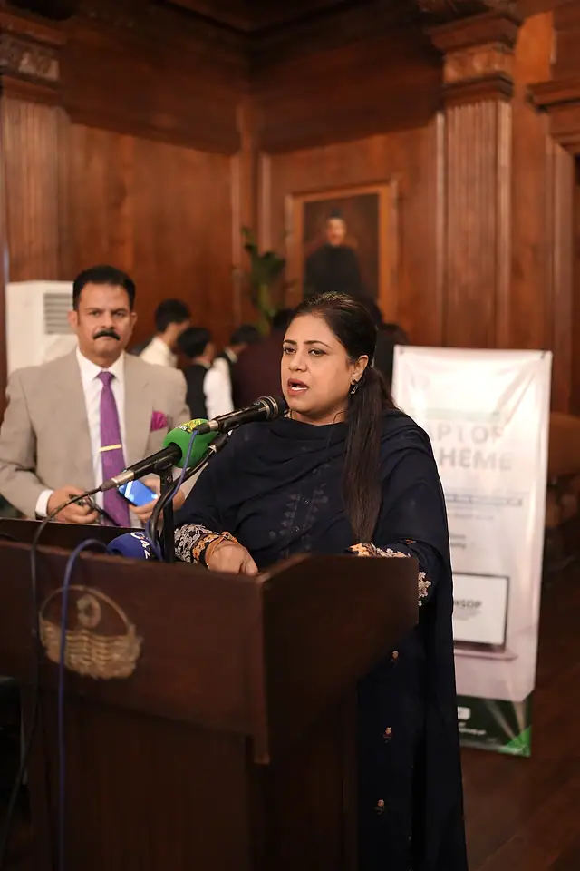 A woman speaks at the podium