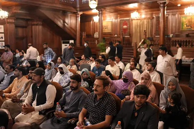 Young people seated in the audience