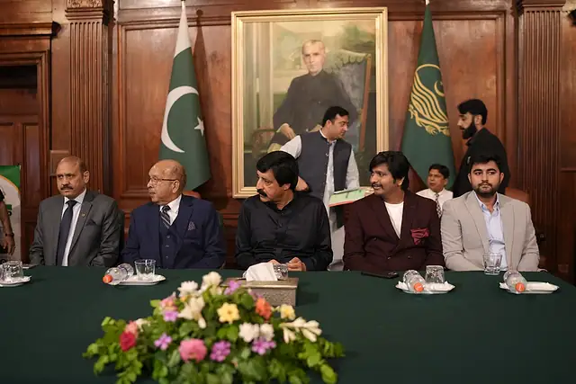 Guests seated at a flower-decorated stage table